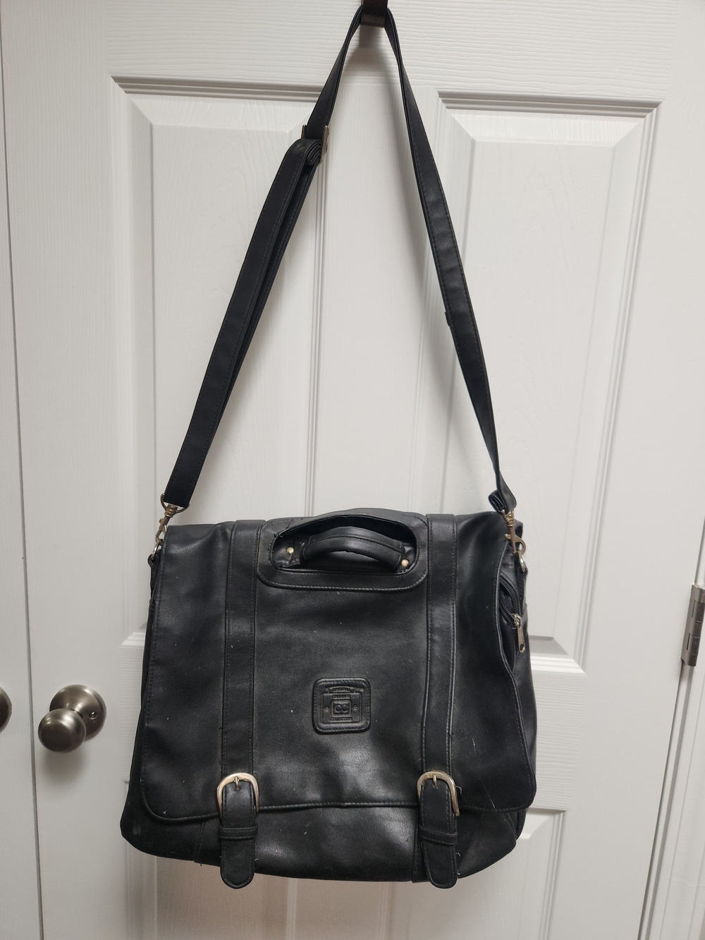 Black Leather Messenger Bag with Top Handle and Adjustable Shoulder Strap